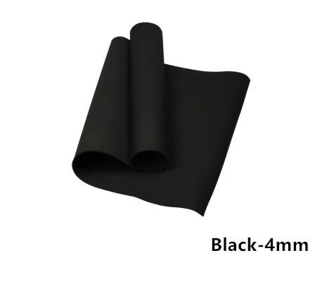 Black yoga mat rolled and folded, showing dark foam texture