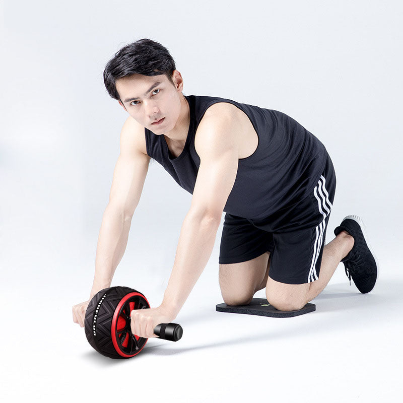 Abdominal wheel with black body and red-rimmed wheel, two foam handle grips