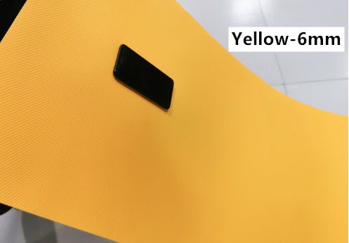 Yellow 6mm EVA yoga mat with textured grip surface and black handle tab