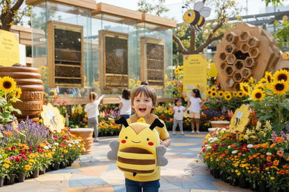 Yellow plush bee-striped backpack with smiling face, front pocket, padded straps