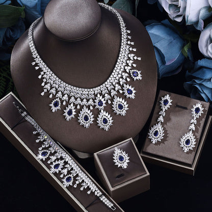 Silver-tone vintage wedding necklace, matching earrings and bracelet set with blue stones