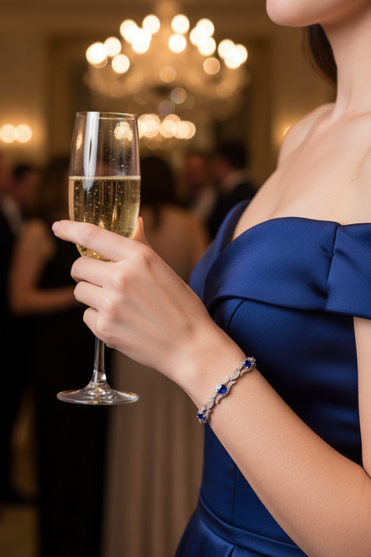 Oval blue sapphire bracelet in sterling silver with shimmering pavé settings