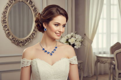 Diamond fashion necklace set with blue oval stones and matching drop earrings