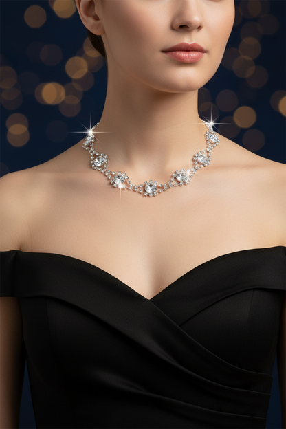 Rhinestone necklace with central round stones and curved silver-tone sparkle, teardrop accents
