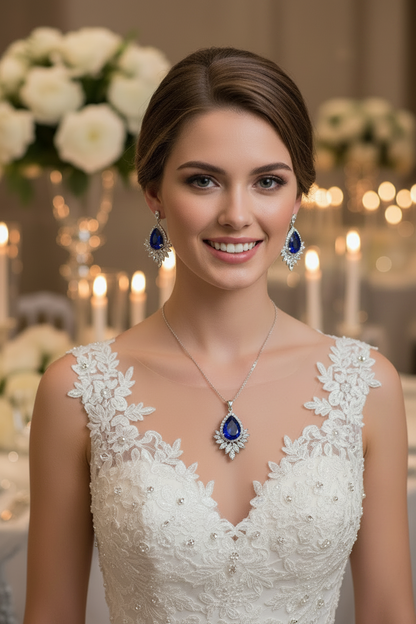 Bridal jewelry set with silver-toned necklace and blue teardrop drop earrings