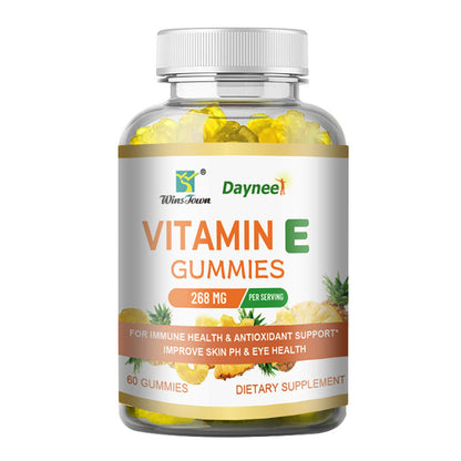 Vitamin E gummies bottle with clear window and yellow gummy pieces inside