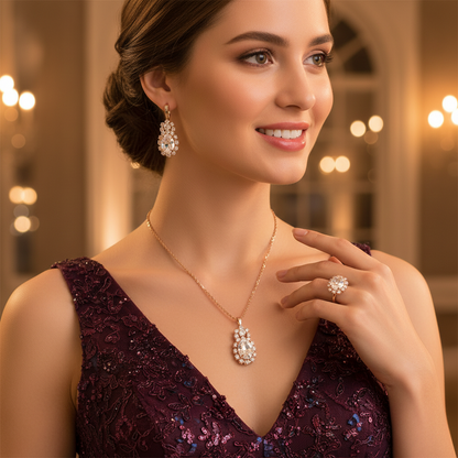Bridal jewelry set with diamond-look oval pendant necklace, matching earrings, and ring