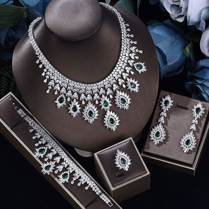 Vintage wedding necklace and earring set with green crystal accents, silver-tone.
