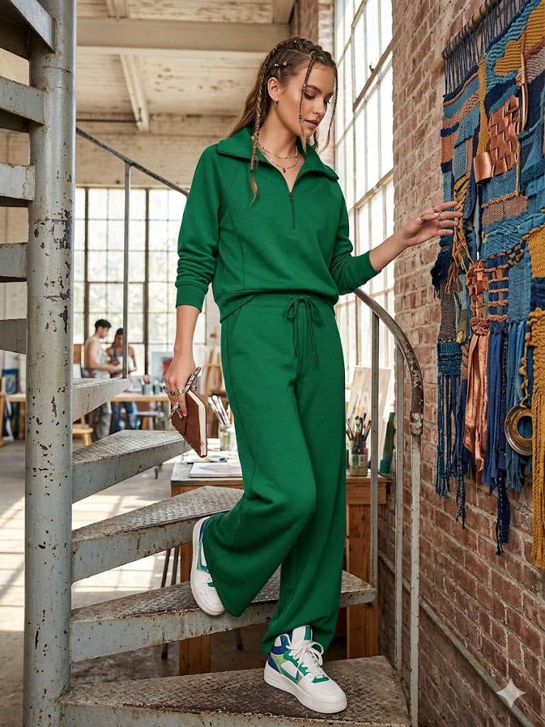 Green two-piece lounge set with zip-front long-sleeve sweatshirt and wide-leg pants