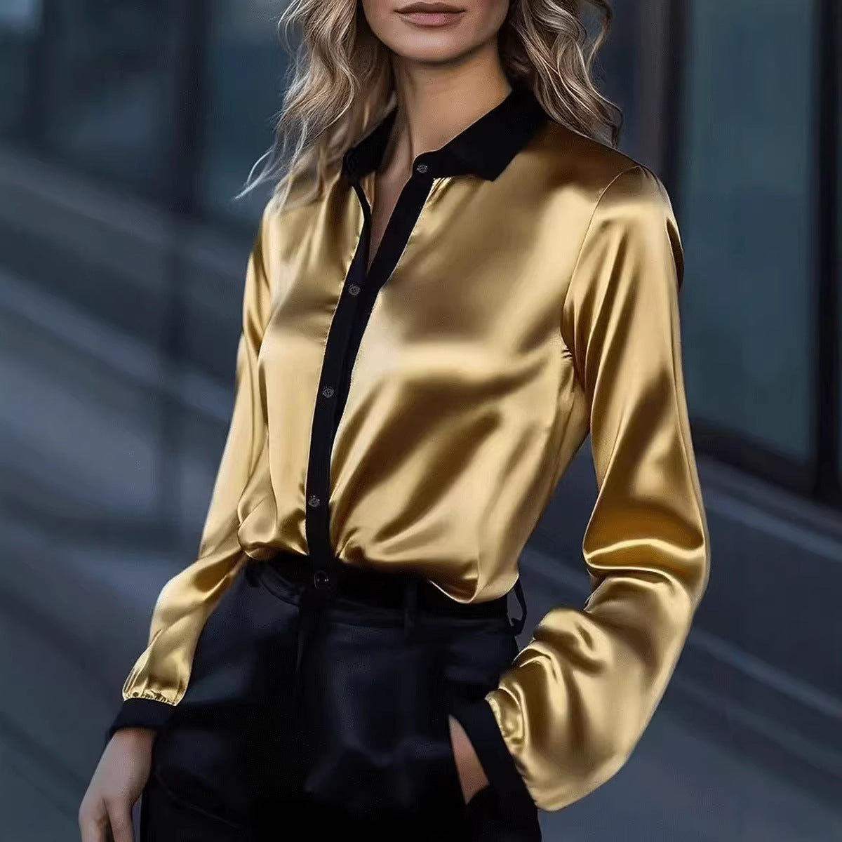 Women's satin long-sleeve shirt with black collar and button placket, gold