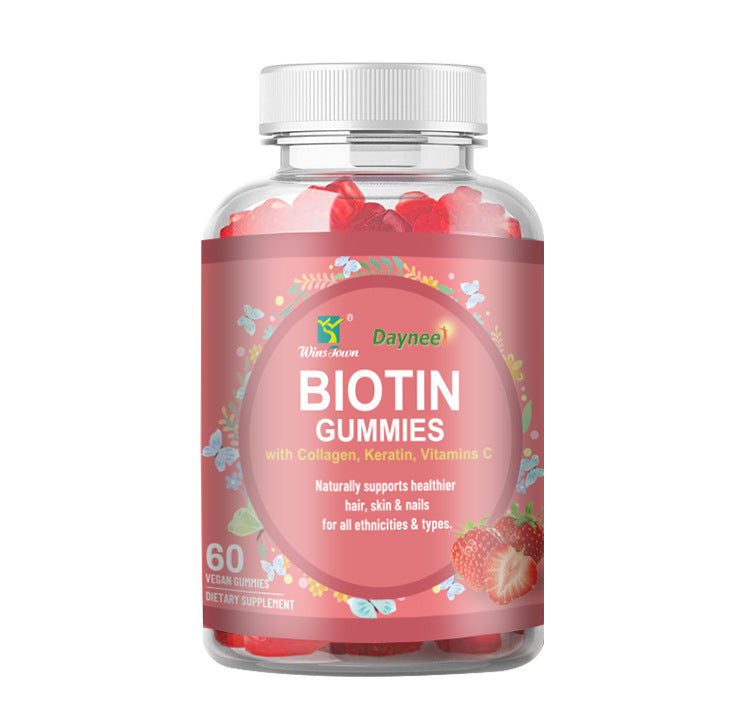 Gummy supplement bottle with red gummies and white ribbed cap