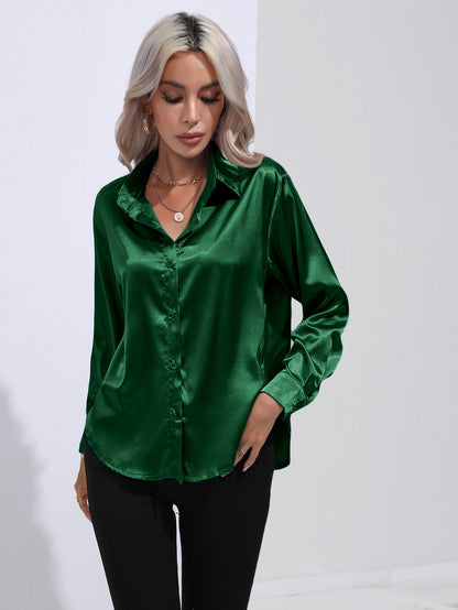 Green satin button-up shirt with long sleeves and pointed collar