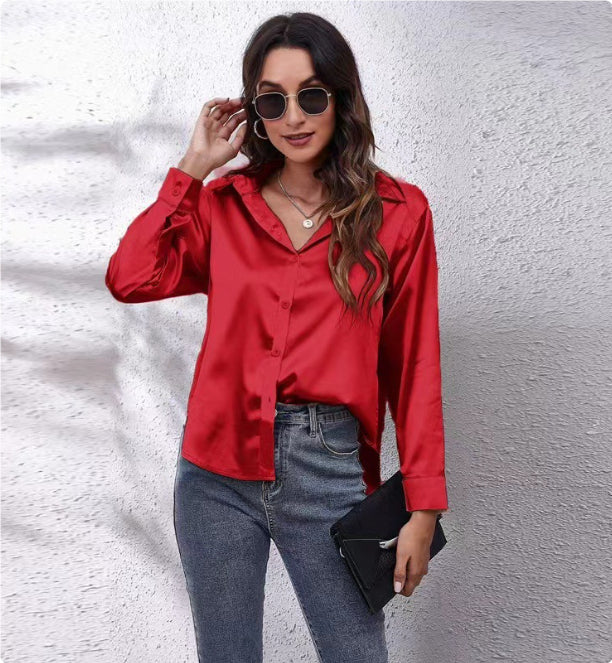 Red satin button-up shirt with long sleeves and pointed collar