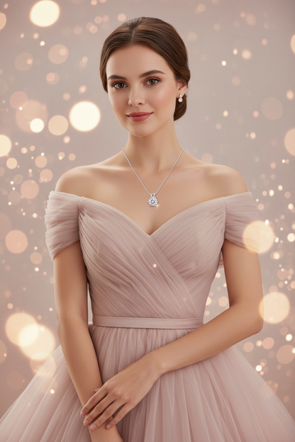 Silver pendant necklace on an off-shoulder blush dress, round crystal pendant