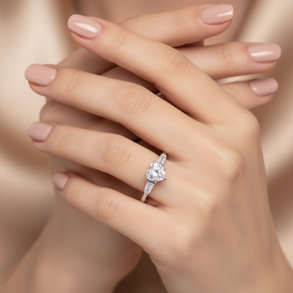 Silver ring with large square-cut gemstone in four-prong setting, close-up