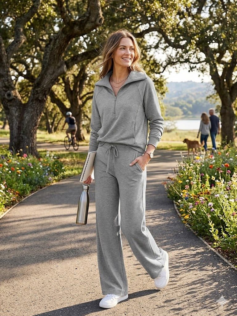 Gray two-piece lounge set with zip-front long-sleeve sweatshirt and wide-leg pants