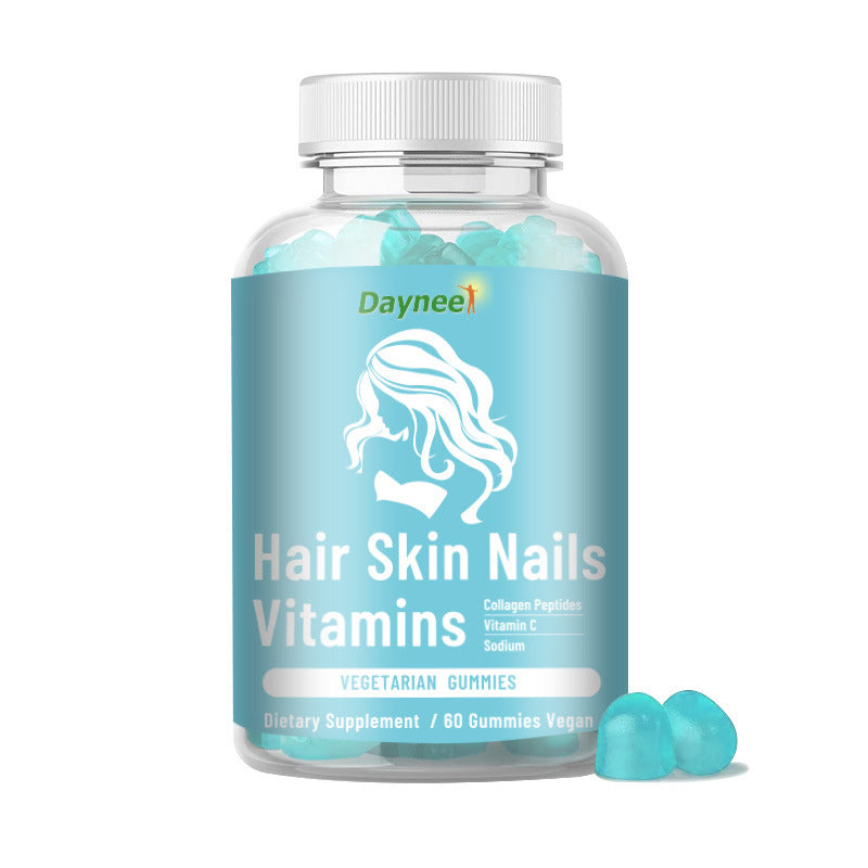 Gummy supplement bottle with blue gummies and white ribbed cap