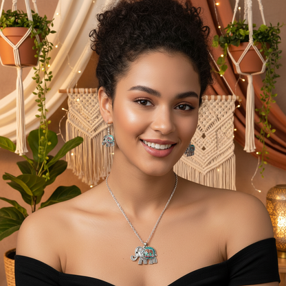 Silver elephant jewelry set featuring elephant pendant necklace and drop earrings.