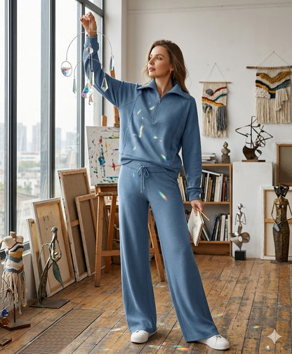 Blue two-piece tracksuit with quarter-zip long-sleeve top and wide-leg pants