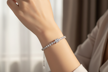 Silver diamond-style tennis bracelet with chain extender and heart charm
