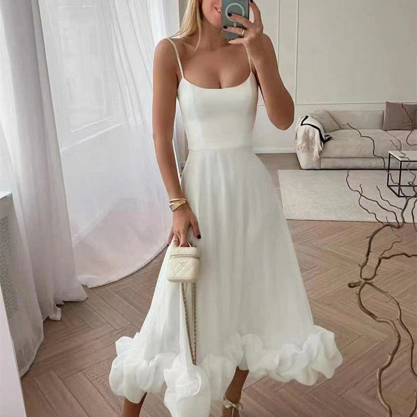 White A-line dress with spaghetti straps and 3D flower hem ruffle