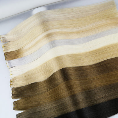 Straight real hair extension weft, mixed blonde and dark brown strands