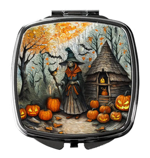 Compact mirror with witch and pumpkin Halloween artwork on silver-tone case
