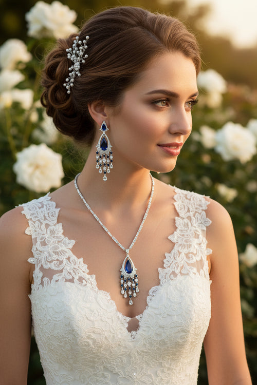 Bridal rhinestone necklace with blue teardrop pendant and drop earrings, side view