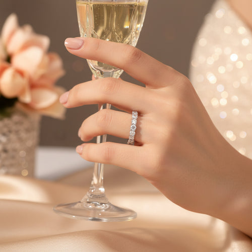 Silver moissanite diamond tennis ring with a full row of small round stones