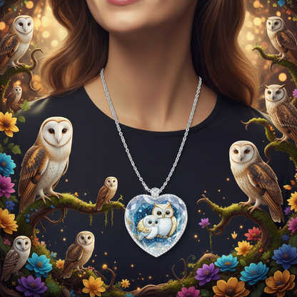 Silver chain necklace with blue heart owl pendant under clear glass