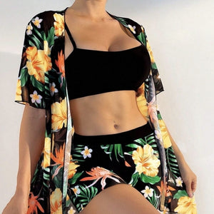 Floral print sheer kimono shirt over black crop top, styled with matching floral shorts