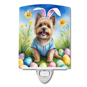 Ceramic night light featuring a Cairn terrier in a blue Easter shirt, with a paw and eggs