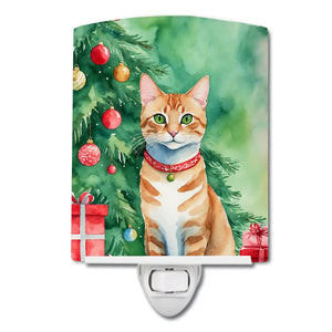 Ceramic cat night light with green holiday tree and red ornament collar