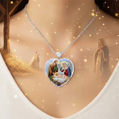 Heart-shaped crystal pendant necklace close-up on silver chain with nativity scene