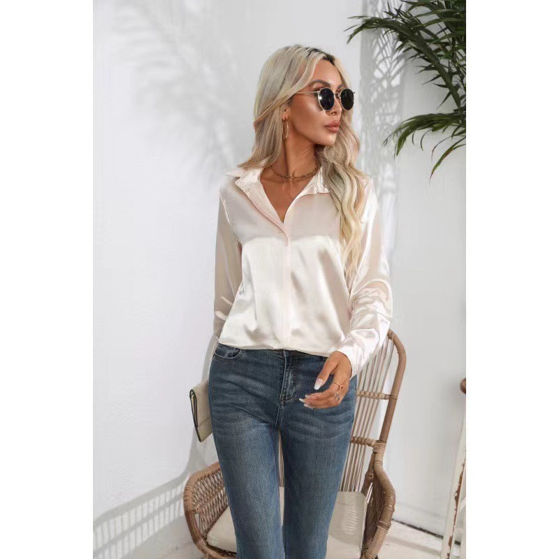 White satin button-up long-sleeve shirt with one-button placket and pointed collar.