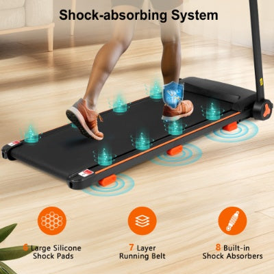 Black treadmill with shock-absorbing system on the running deck, side view.