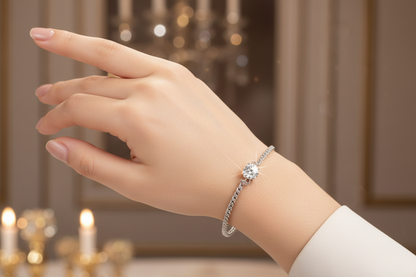 Silver diamond bracelet with round center stone on wrist, arm extended