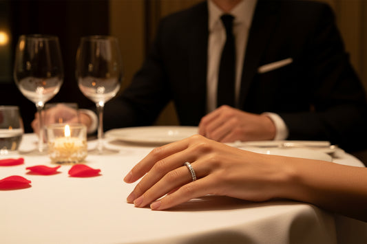 Silver moissanite diamond row ring on a hand, stones line the band.