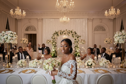White lace wedding gown with long sleeves, sweetheart neckline, and full skirt