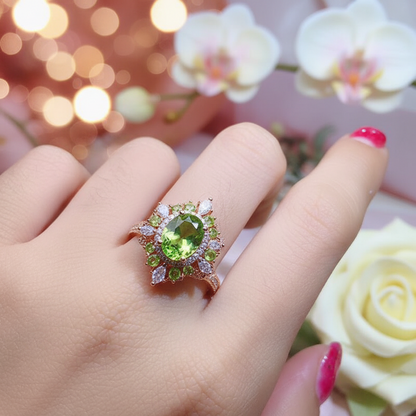 Gold halo peridot ring with round green center