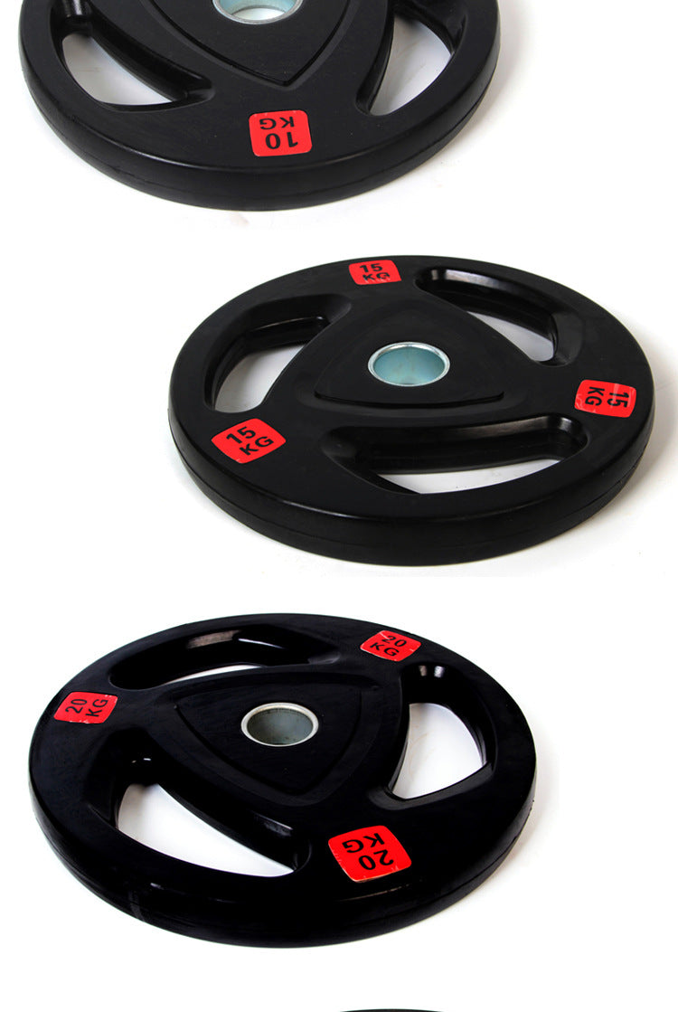 Three black 2.5 kg barbell weight disks with red KG labels and center holes