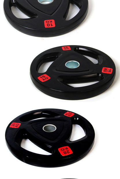 Three black 2.5 kg barbell weight disks with red KG labels and center holes