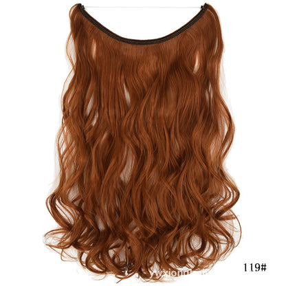 Wavy hair extension wig in copper orange, curved top, long layered waves