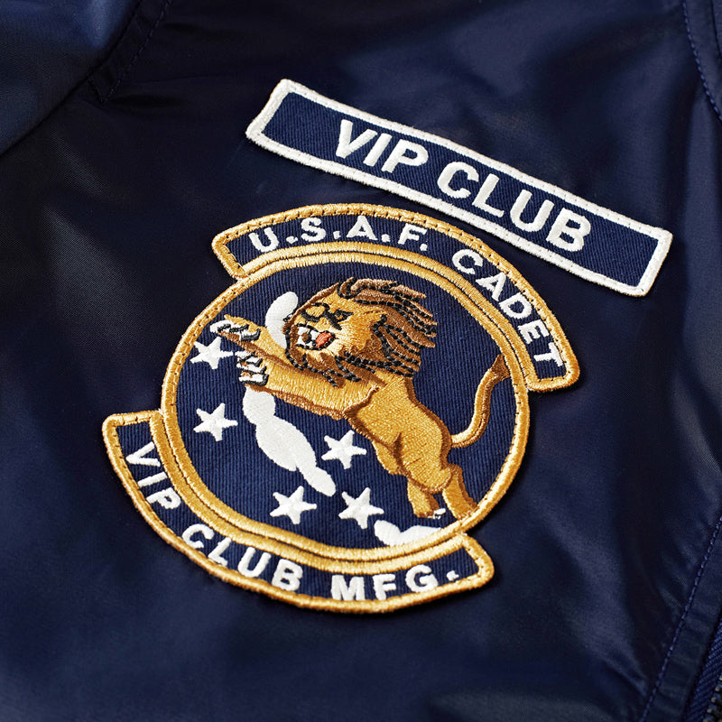 Embroidered VIP CLUB patch on a dark bomber jacket