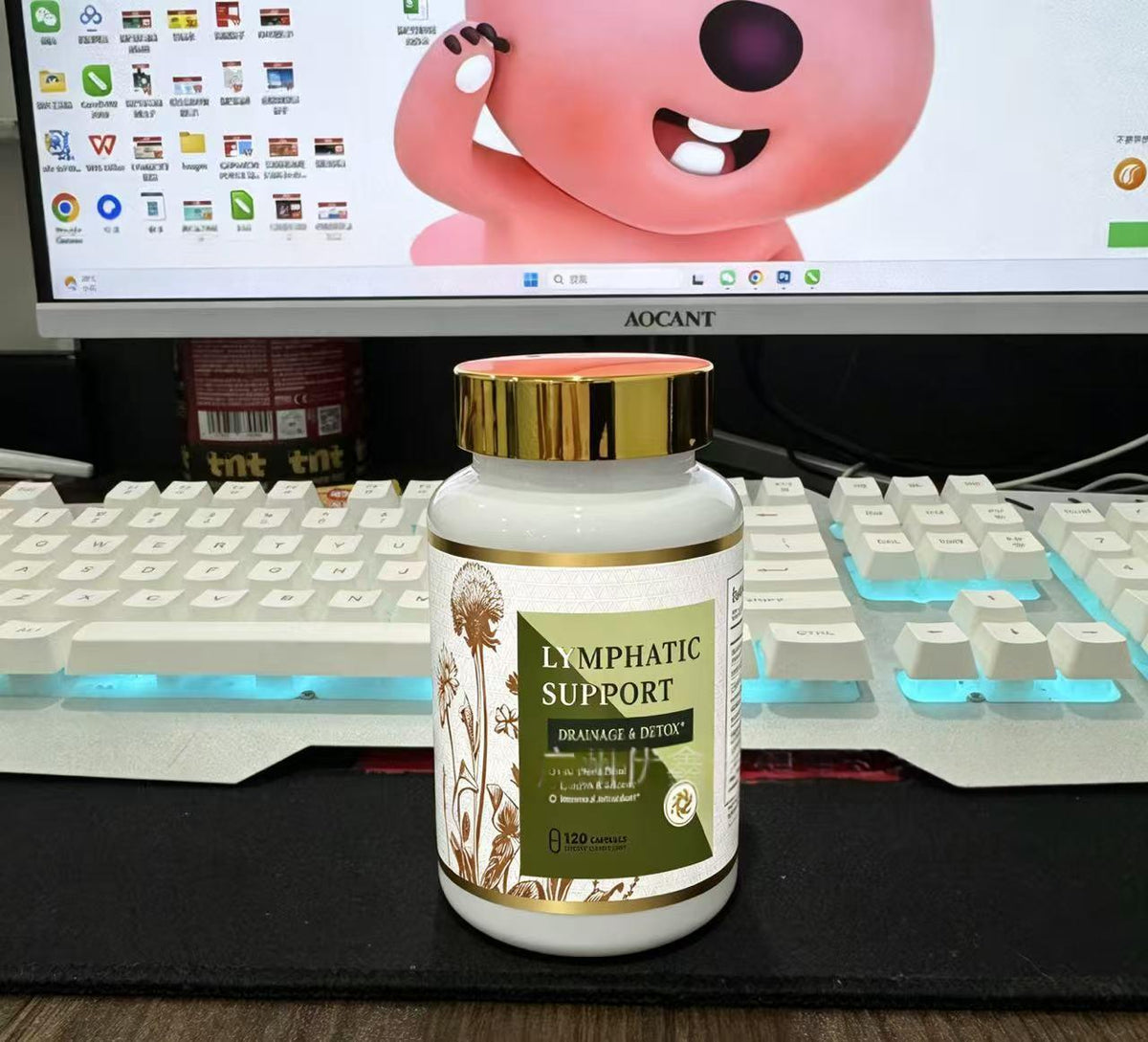 Lymphatic support capsules bottle with gold cap on desktop