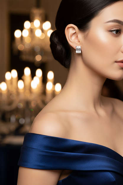 Silver diamond-style stud earrings, rectangular stones shown on ear
