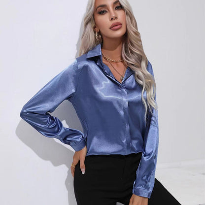 Blue satin button-up long-sleeve shirt with one-button placket and pointed collar.