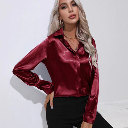 Red satin button-up long-sleeve shirt with one-button placket and pointed collar.
