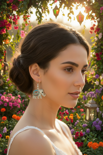 Silver elephant drop earrings and elephant pendant necklace outdoors