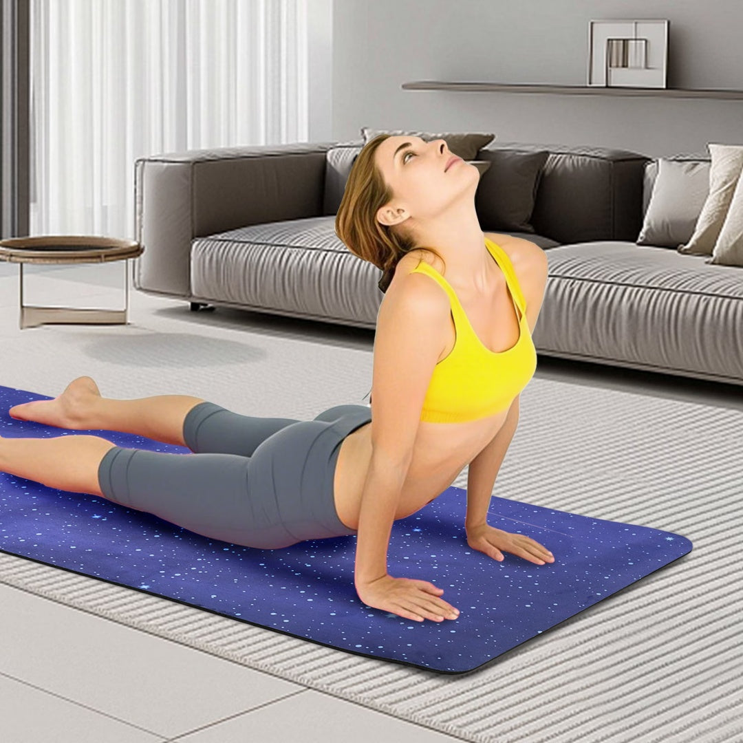 Blue printed yoga mat used for floor exercise, non-slip surface visible